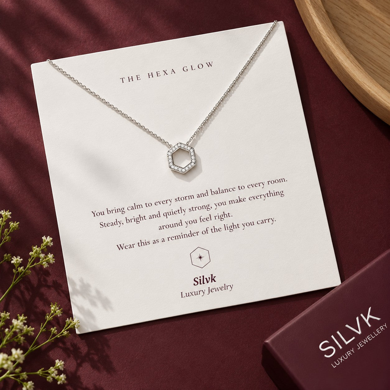 The Hexa Glow pendant on its message card with a Silvk gift box, Silvk 925 silver jewellery