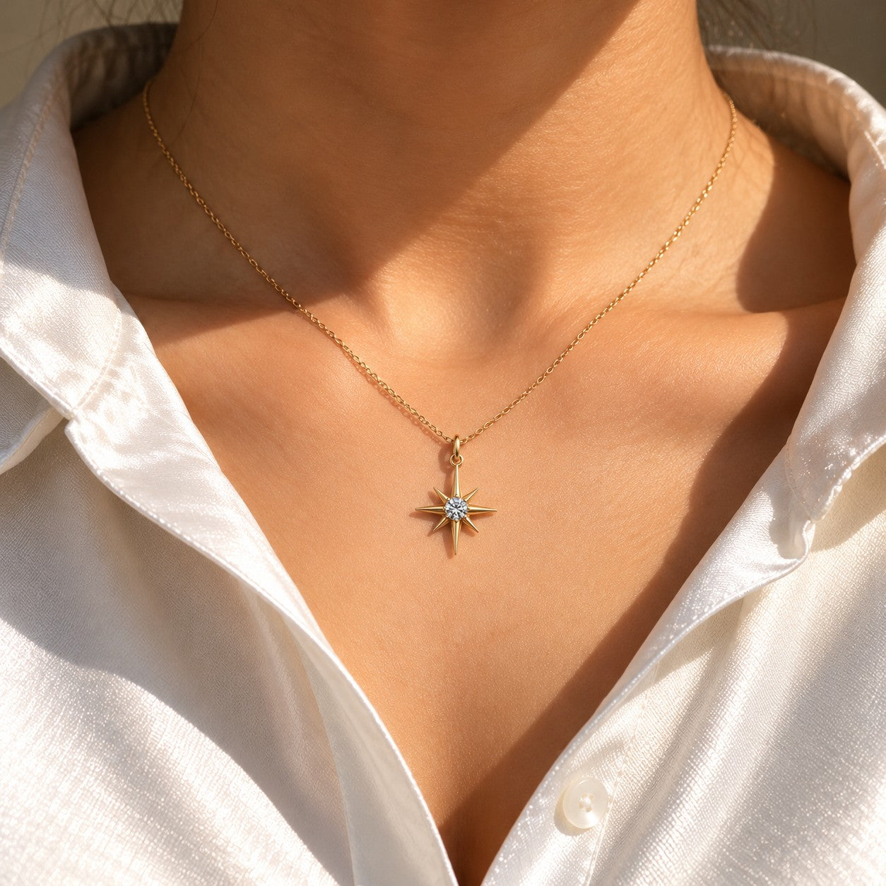 Eternal Star gold star pendant worn on the neck with a white shirt, Silvk 925 silver jewellery
