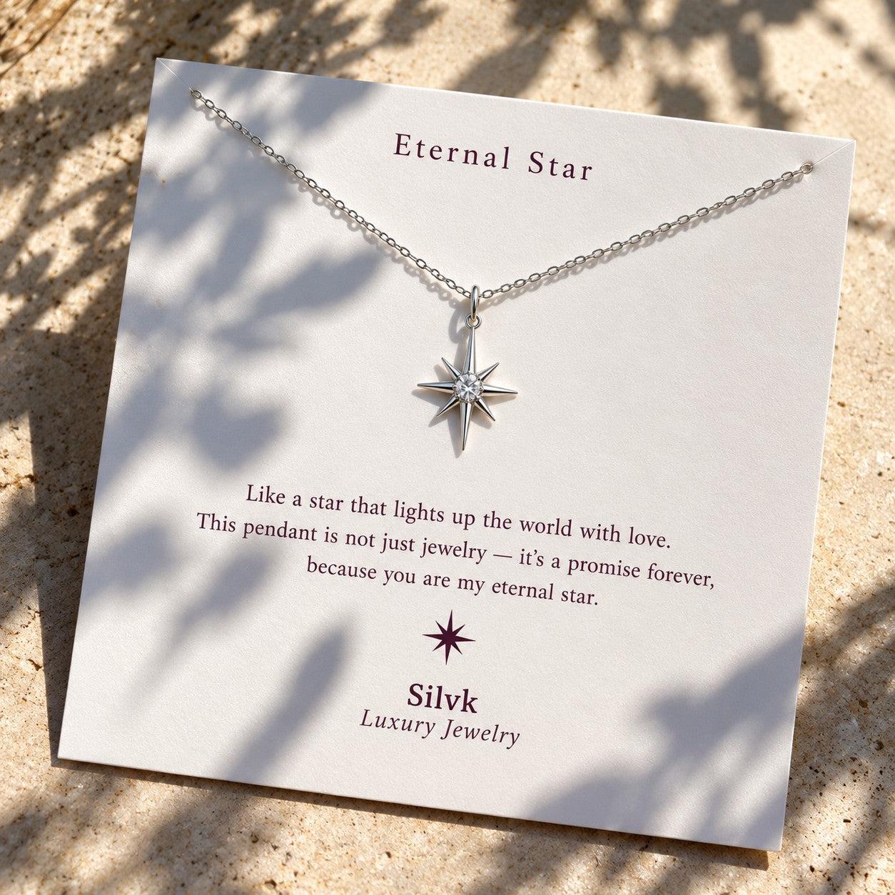 Eternal Star pendant on its message card in sunlight, Silvk 925 silver jewellery