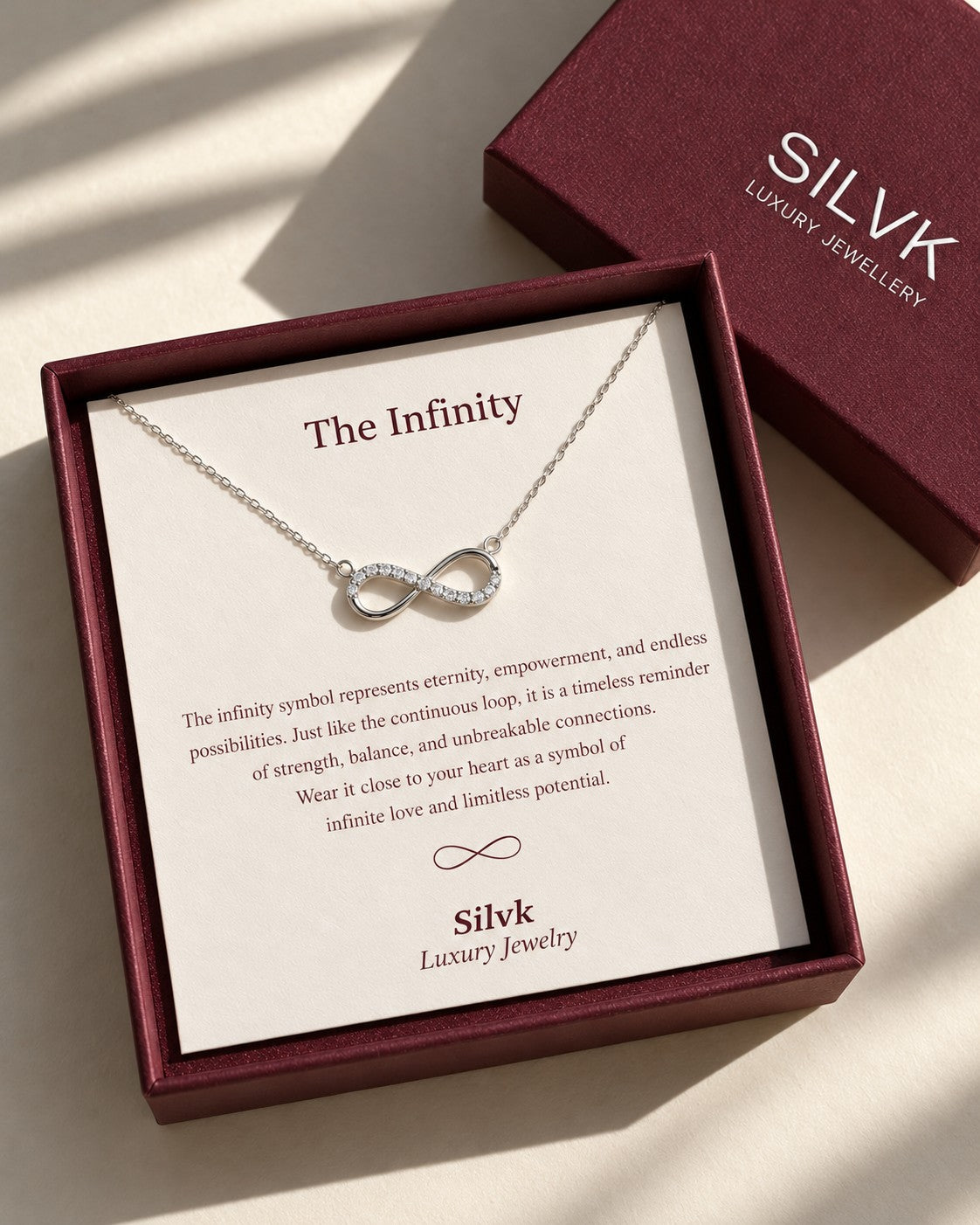 The Infinity silver pendant necklace in an open Silvk gift box with its message card, Silvk 925 silver jewellery